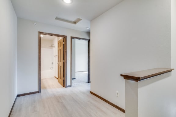a bedroom with a medium sized bed and a mirror