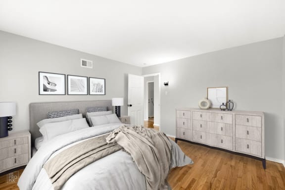 a bedroom with a bed and a dresser
