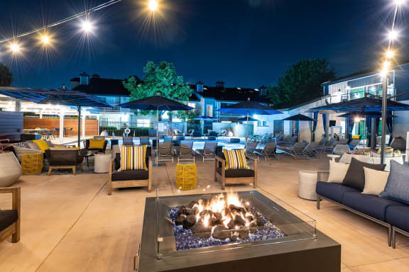 Outdoor fire pit with seating in pool area at Aliso Creek, Aliso Viejo, CA