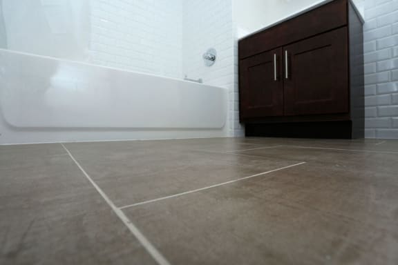 close up shot of the tile floor of bathroom