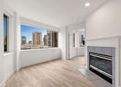 Thumbnail 39 of 67 - Modern living room with a fireplace at AVIA on Pike Street, Seattle, WA, 98101