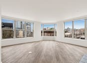 Thumbnail 32 of 67 - Large empty room with Wooden floor at AVIA on Pike Street, Seattle, Washington
