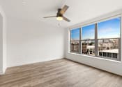 Thumbnail 47 of 67 - Room with ceiling fan and large windows at AVIA on Pike Street, Seattle, WA, 98101