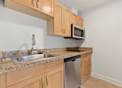 Thumbnail 43 of 67 - Kitchen with stove top oven at AVIA on Pike Street, Seattle, WA, 98101