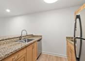 Thumbnail 54 of 67 - Granite Countertop in Kitchen with Sink at AVIA on Pike Street, Seattle, WA, 98101