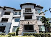 Thumbnail 48 of 62 - Exterior of apartment complex at The Grove Apartments, Ontario, CA, 91761
