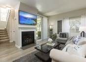 Thumbnail 14 of 28 - Apartments for Rent in Dana Pointe - Harbor Pointe - Living Room with Fireplace, Glass Countertop, and Spacious Window at Harbor Pointe, Dana Point, California
