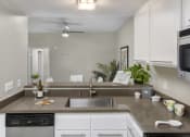 Thumbnail 18 of 28 - Kitchen with stainless steel appliances at Harbor Pointe, California