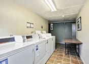 Thumbnail 8 of 14 - Laundry Room at Miners Mesa Apartments, Golden, CO