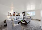 Thumbnail 2 of 6 - Carpeted Living Room at Stratford Plaza South, Colorado
