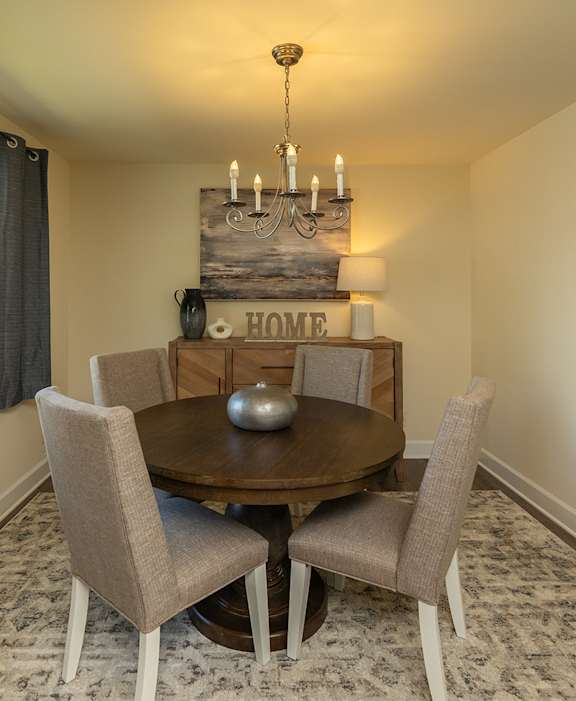 Spacious living room with private balcony  at Brittany Apartments, Baltimore, Maryland