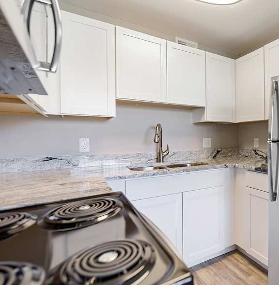 A kitchen with a stove, sink, and refrigerator. at Park 146, Colorado