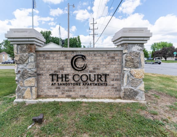 the court at banning apartments entrance sign