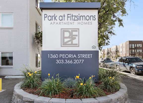 the sign for park of fishmongers apartment homes in front of a parking lot at Park at Fitzsimons Apartments, Aurora, MO, 80011
