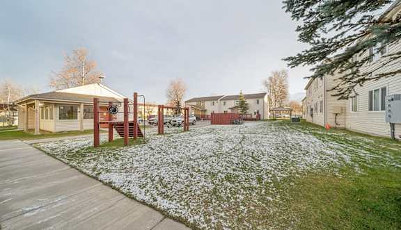 two men riding a bike down a trail at Northridge Terrace Apartments, Palmer, AK, 99645