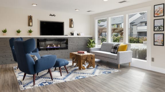 Living room with a fireplace and a tv above it at Brookside 112, Vancouver, WA