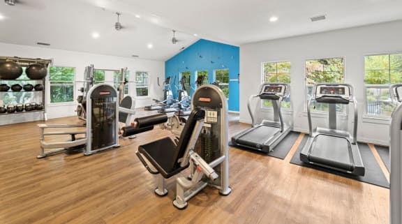 a home gym with weights and exercise equipment