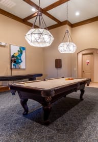 a billiards room with a pool table at Avignon Apartment Homes, Olathe, KS