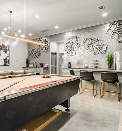 a game room with a pool table and a bar  at Serene at Creekstone, Georgia, 30601
