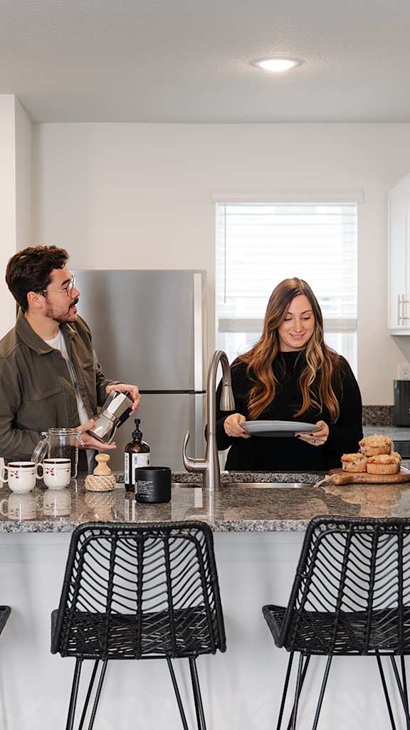 a man and a woman standing at a kitchen counter at Forge65, Iowa, 50327