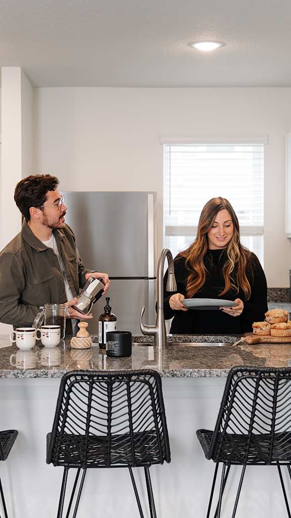 a man and a woman standing at a kitchen counter at Forge65, Iowa, 50327