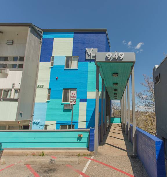 A blue and white building with the number 949 on it.