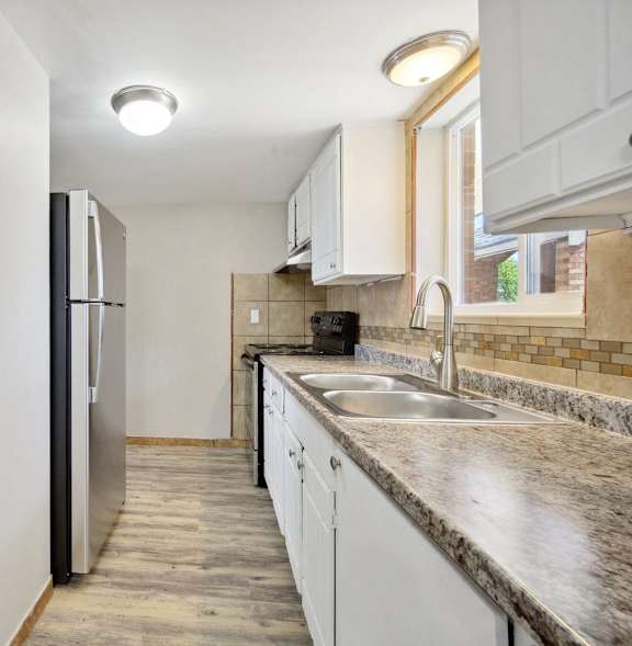 Granite Countertop at Quari Street Apartments, Aurora, 80011
