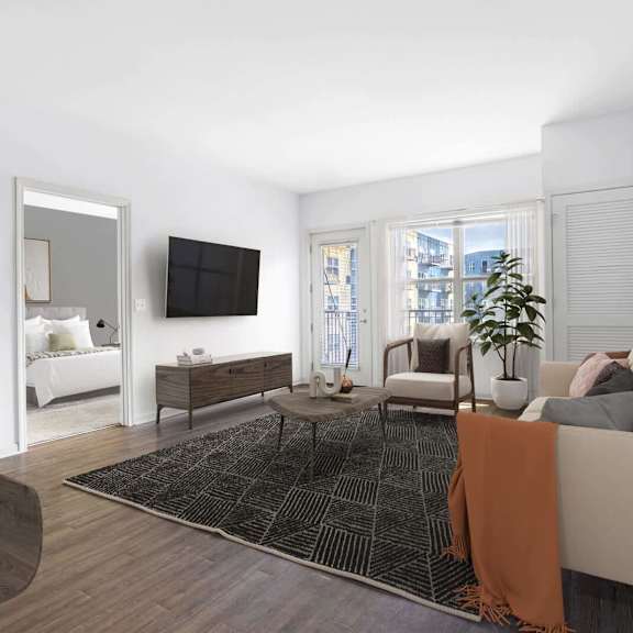 a living room with a couch and a tv at Wheaton 121, Wheaton, IL