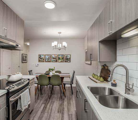 a kitchen and dining area in a 555 waverly unit