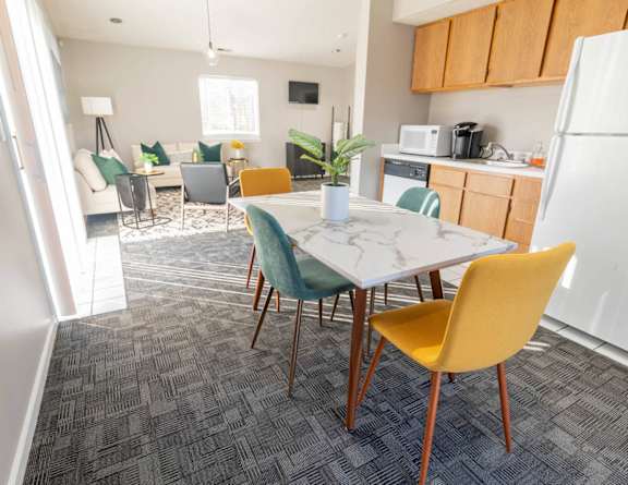 The clubhouse with a lounge area and kitchen at Creekside Square Apartments in Indianapolis, IN 46254