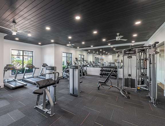 a gym with weights and cardio equipment at the enclave at woodbury