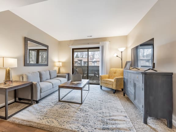 Living Room With TV at Whisper Hollow Apartments, Missouri, 63043