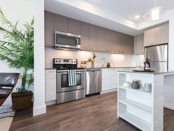 a kitchen with stainless steel appliances and granite countertops