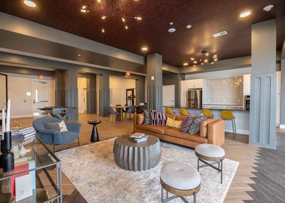 A kitchen with wooden floors and stainless steel appliances.at Hawthorne Pointe, Bondurant, 50035