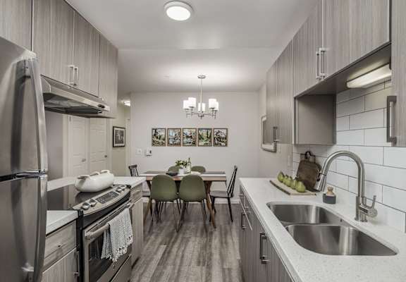 an open kitchen and dining room with a table and chairs