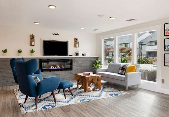 Living room with a fireplace and a tv above it at Brookside 112, Vancouver, WA