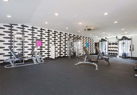Gym at the enclave at woodbridge apartments in sugar land, tx