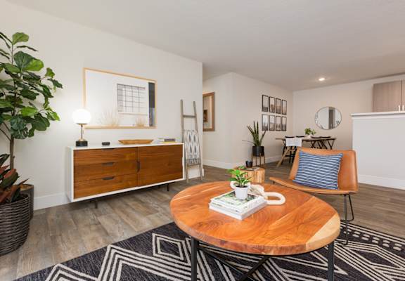 Living room with a coffee table and a dining room table at Brookside 112, Vancouver,  98682