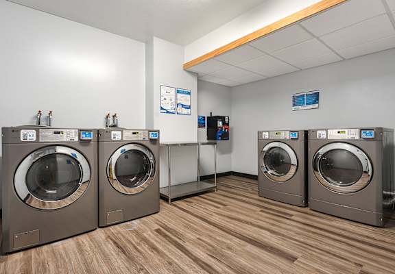A row of washing machines in a laundromat.