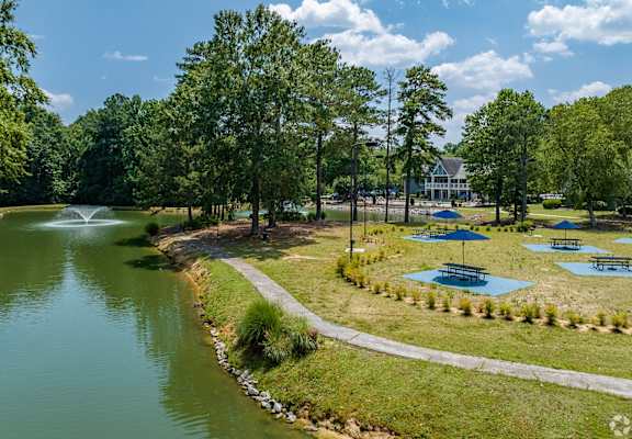 a park with a lake and a fountain