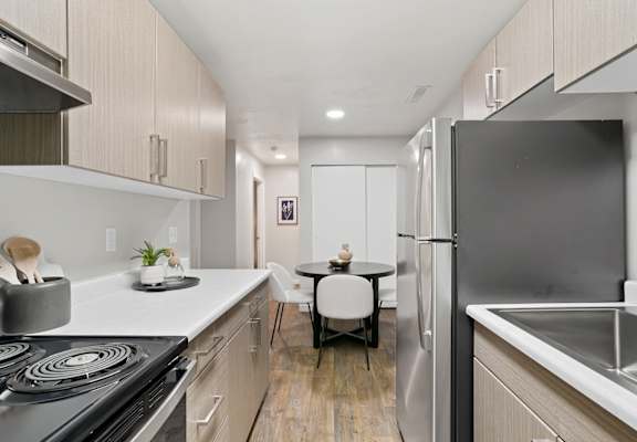 a kitchen and dining area in a 555 waverly unit