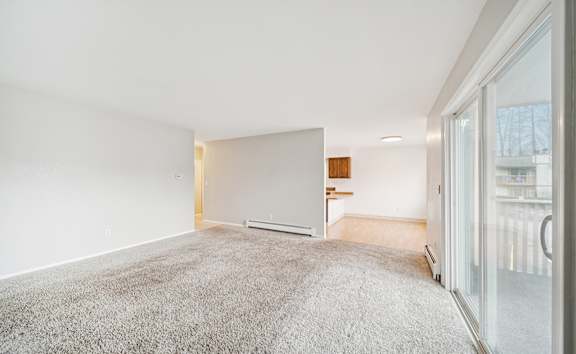 a living room with a fireplace and a large window  at ReNew Eagle River, Alaska, 99577
