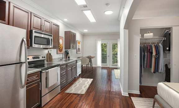 a kitchen and living room in a 555 waverly unit