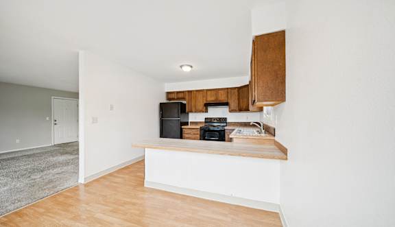Kitchen with Wooden cabinets at ReNew Eagle River, Eagle River, Alaska