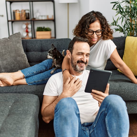 Couple on couch looking at tablet at Laurel Creek, Fairfield, CA, 94533