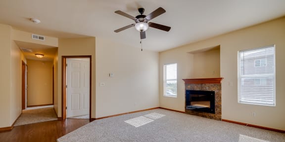 Spacious Bedroom with Large Double Window and Ceiling Fan with Light