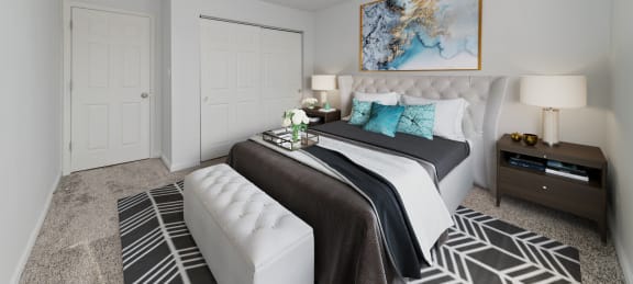 a bedroom with a large bed and a white couch at Lawrence Landing, Indianapolis, Indiana