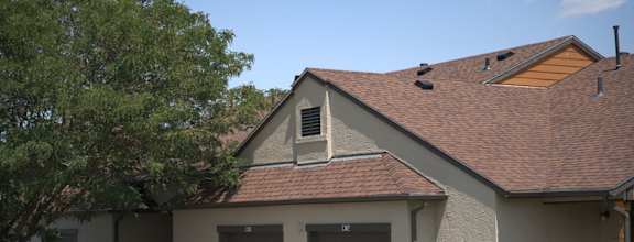 a garage with three doors on the side of a house  at Antelope Ridge, South Dakota, 57719
