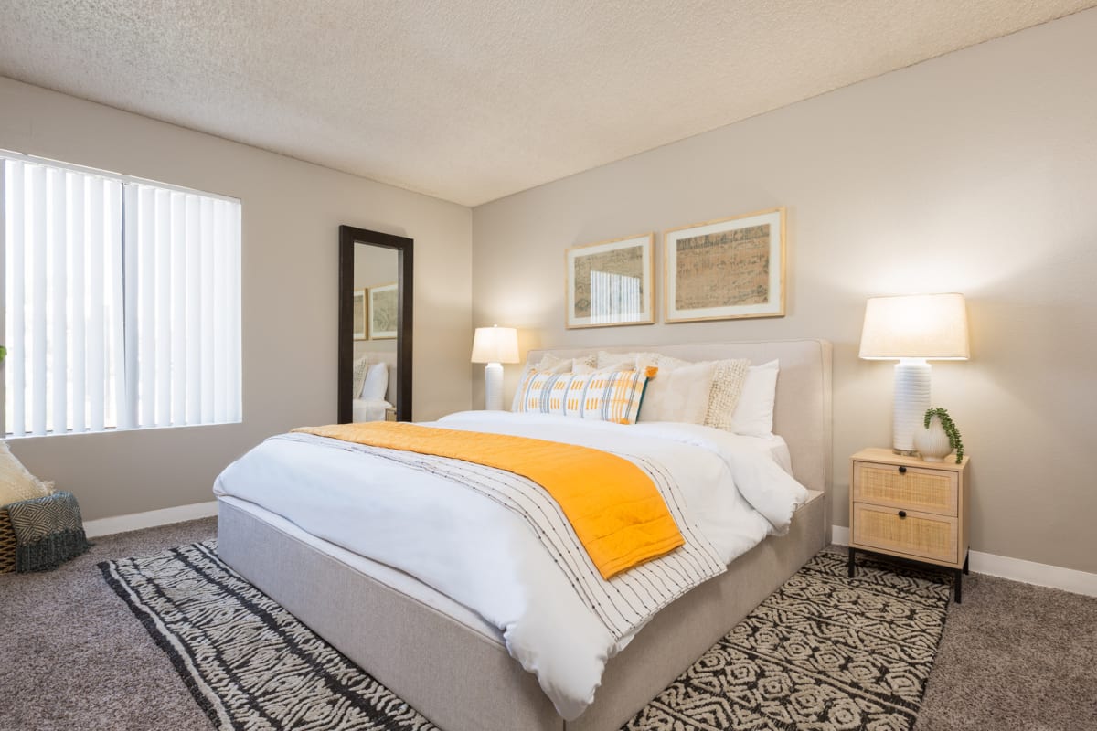 Furnished bedroom shown — representative home at Reveal.