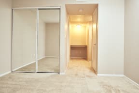 Alta Vista Apartments in Escondido, CA with Wall to wall carpet, mirrored closet, white walls, window